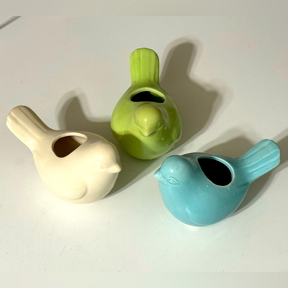 Trio of ceramic birds that can hold candles.